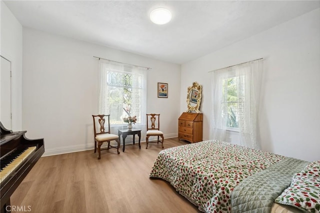 318 E 11th St, Pomona, CA 91766 - bedroom with baseboards and light wood-style flooring
