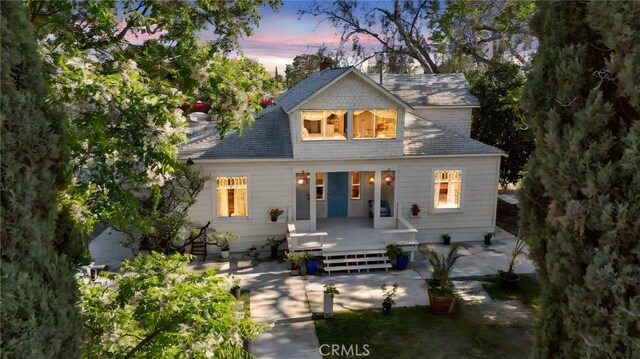 318 E 11th St, Pomona, CA 91766 - rear view of property featuring a chimney and a patio