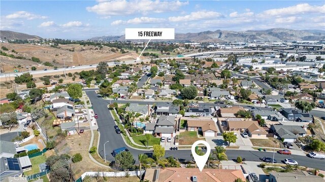 bird's eye view with a residential view and a mountain view