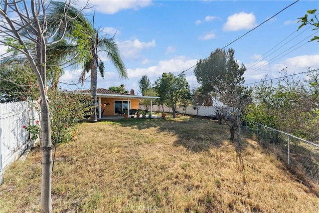 view of yard with a fenced backyard