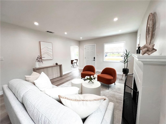 834 Morada Pl, Altadena, CA 91001 - living area with light wood finished floors, a fireplace, baseboards, visible vents, and recessed lighting