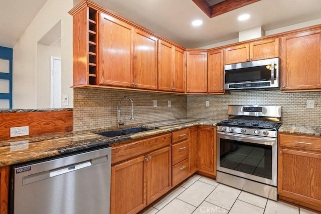 44863 Rein Ct, Temecula, CA 92592 - kitchen featuring appliances with stainless steel finishes, open shelves, dark stone countertops, tasteful backsplash, and light tile patterned floors