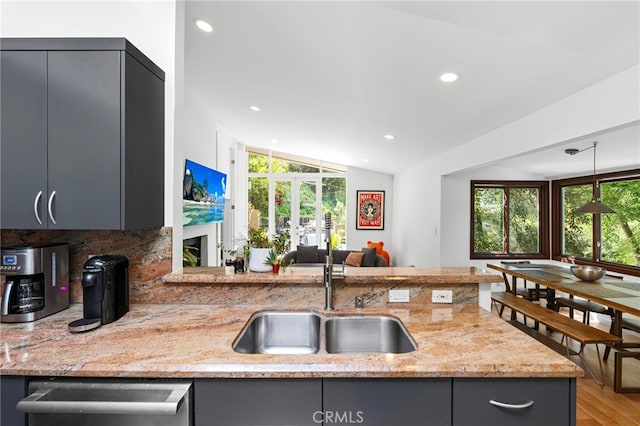 2402 Aspen Dr, Los Angeles, CA 90068 - kitchen featuring stainless steel dishwasher, a sink, a healthy amount of sunlight, recessed lighting, and gray cabinets