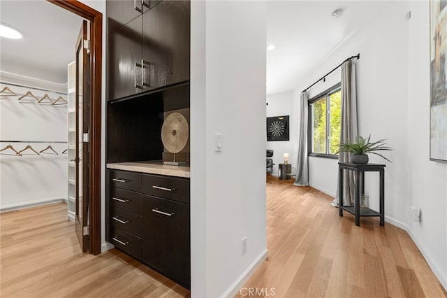 2402 Aspen Dr, Los Angeles, CA 90068 - hall with light wood-type flooring, baseboards, and recessed lighting