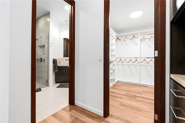 2402 Aspen Dr, Los Angeles, CA 90068 - corridor with baseboards and light wood-style floors