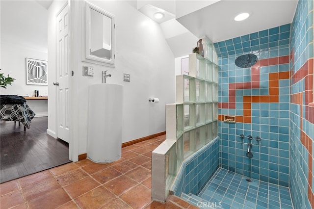 2402 Aspen Dr, Los Angeles, CA 90068 - bathroom with a tile shower, baseboards, and recessed lighting