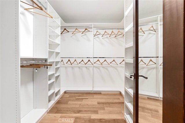 2402 Aspen Dr, Los Angeles, CA 90068 - walk in closet featuring light wood-type flooring