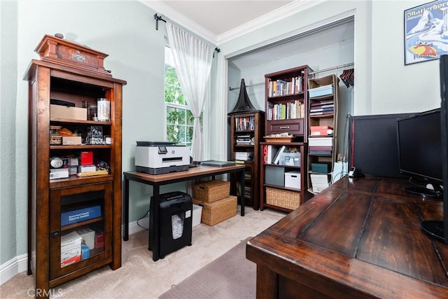 carpeted office space with crown molding