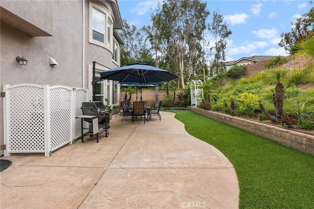 view of patio / terrace with a fenced backyard and outdoor dining area