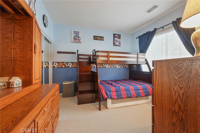 bedroom with carpet flooring and visible vents