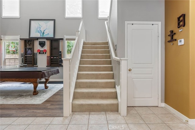 57 E Boulder Creek Rd, Simi Valley, CA 93065 - stairway featuring a healthy amount of sunlight, pool table, tile patterned flooring, and baseboards