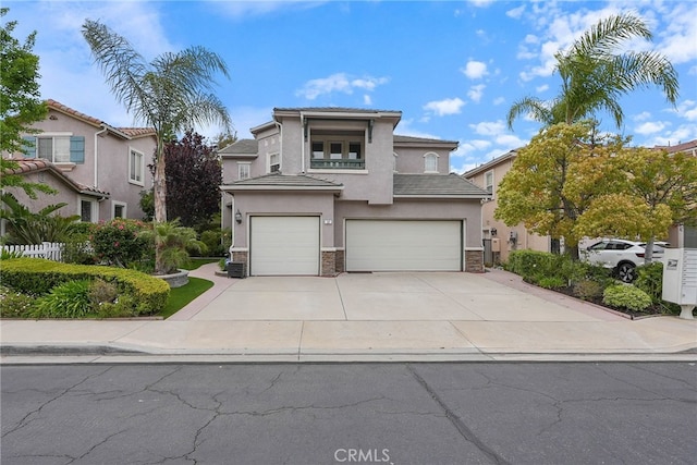 57 E Boulder Creek Rd, Simi Valley, CA 93065 - view of front of home featuring a tile roof, stone siding, a garage, stucco siding, and concrete driveway