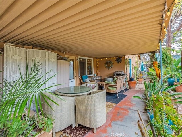 view of patio with outdoor dining area and an outdoor living space