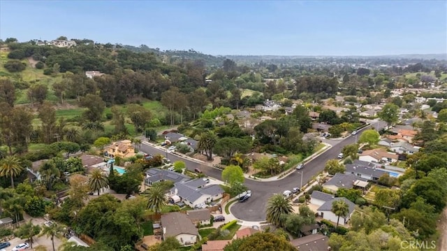 birds eye view of property with a residential view