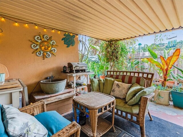 balcony featuring outdoor lounge area and a patio area