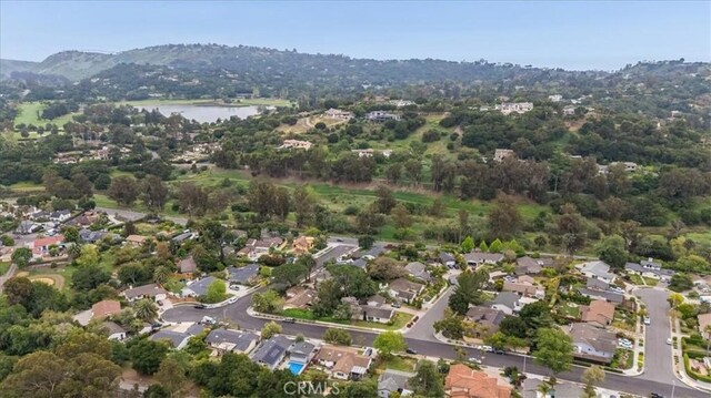 drone / aerial view with a residential view and a water view
