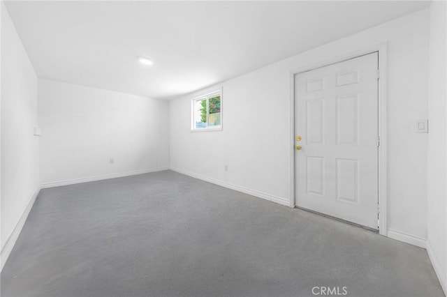 empty room with baseboards