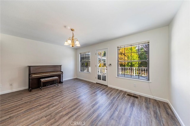 51192 Bon Veu Dr, Oakhurst, CA 93644 - unfurnished living room featuring wood finished floors and a chandelier