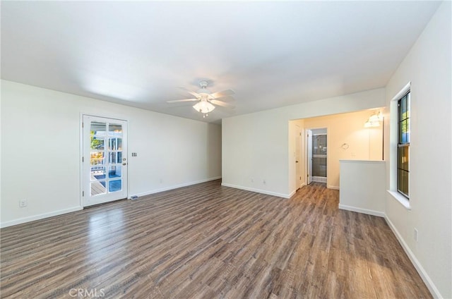 51192 Bon Veu Dr, Oakhurst, CA 93644 - unfurnished living room with wood finished floors, healthy amount of natural light, and a ceiling fan