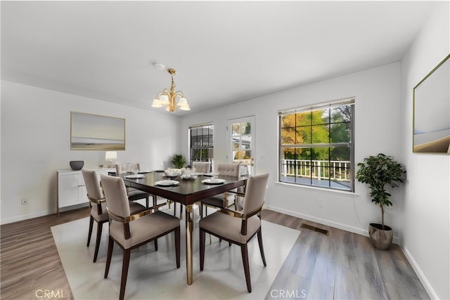 51192 Bon Veu Dr, Oakhurst, CA 93644 - dining area featuring a chandelier and light wood-style floors