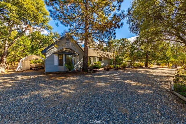 51192 Bon Veu Dr, Oakhurst, CA 93644 - view of front facade with a carport