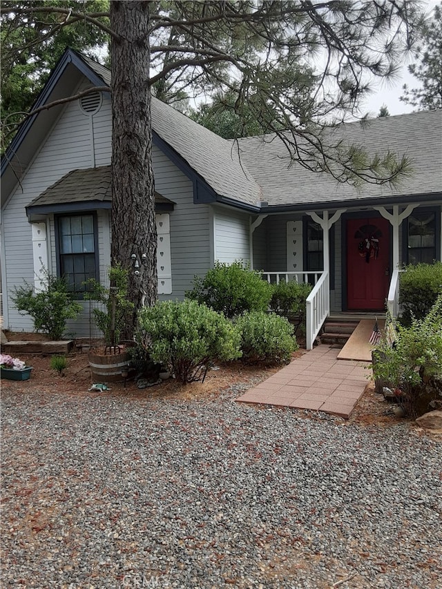 51192 Bon Veu Dr, Oakhurst, CA 93644 - view of front of home featuring a porch and roof with shingles