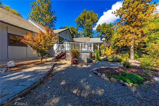 51192 Bon Veu Dr, Oakhurst, CA 93644 - back of house with a wooden deck, stairway, and roof with shingles