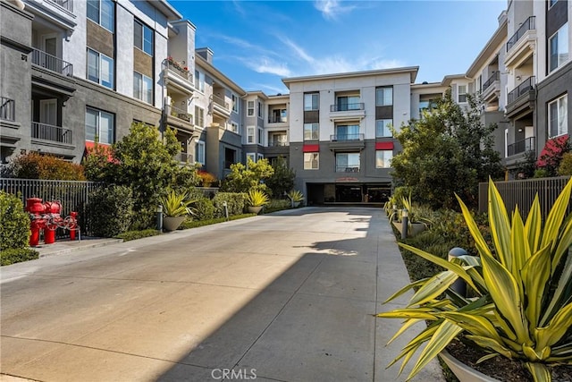 view of concrete driveway with a residential view
