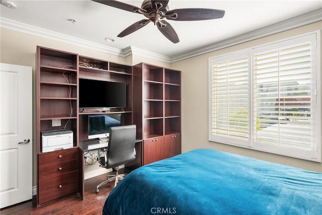 bedroom with ornamental molding, dark wood-type flooring, ceiling fan, and an office area