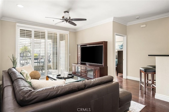 living room featuring baseboards, ceiling fan, dark wood-style flooring, crown molding, and recessed lighting