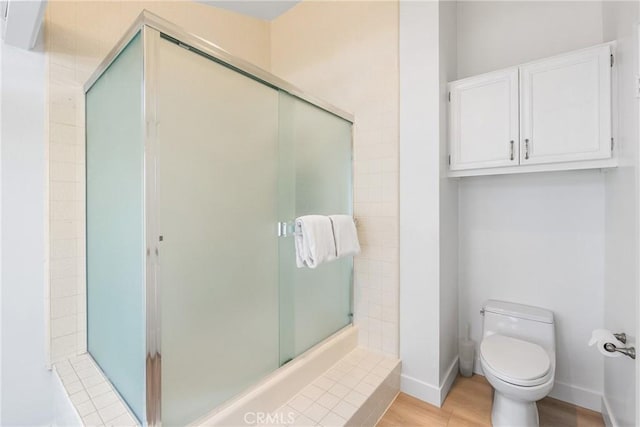 7701 Quimby Ave, West Hills, CA 91304 - bathroom featuring a shower stall and wood finished floors