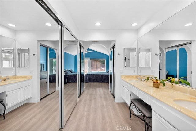 7701 Quimby Ave, West Hills, CA 91304 - ensuite bathroom with double vanity, wood finished floors, and recessed lighting