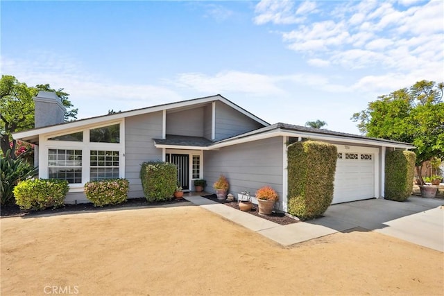 7701 Quimby Ave, West Hills, CA 91304 - mid-century home featuring a garage, a chimney, and concrete driveway