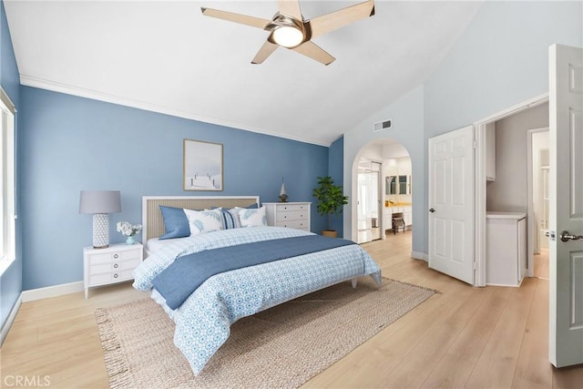 7701 Quimby Ave, West Hills, CA 91304 - bedroom with arched walkways, light wood-style flooring, high vaulted ceiling, ceiling fan, and ensuite bathroom