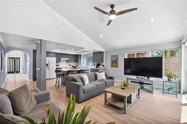 7701 Quimby Ave, West Hills, CA 91304 - living room featuring arched walkways, ceiling fan, recessed lighting, lofted ceiling, and light wood-type flooring