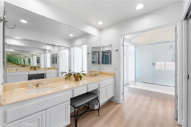 7701 Quimby Ave, West Hills, CA 91304 - full bathroom featuring double vanity, wood finished floors, a shower with shower door, and recessed lighting