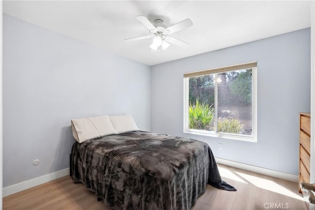 7701 Quimby Ave, West Hills, CA 91304 - bedroom featuring light wood-style floors and a ceiling fan