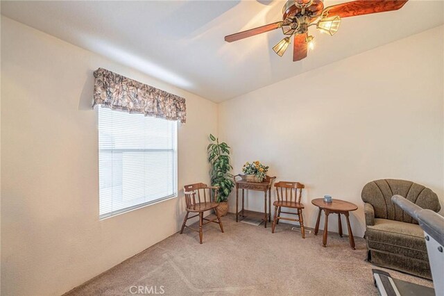 sitting room featuring carpet flooring and ceiling fan