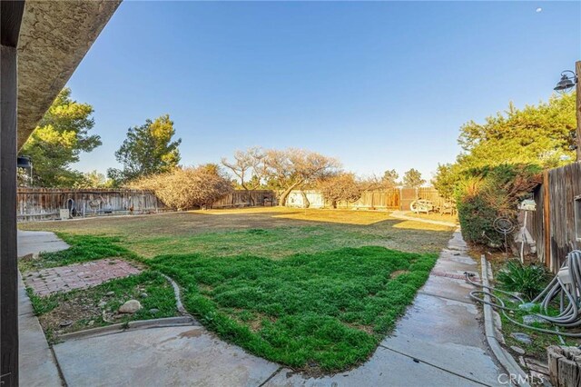 view of yard with a fenced backyard