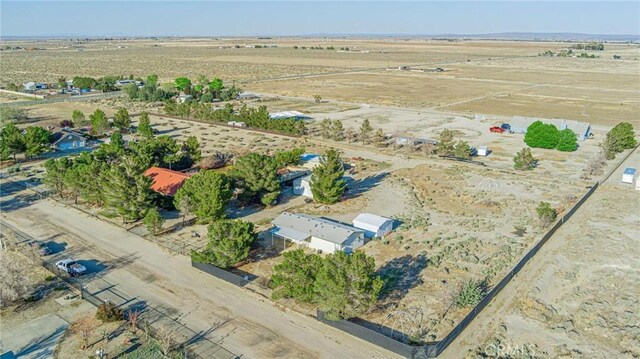 birds eye view of property with a rural view and view of desert
