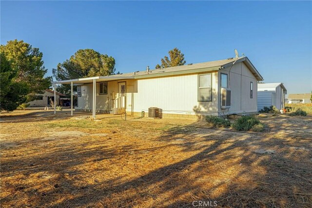 back of property with central AC unit