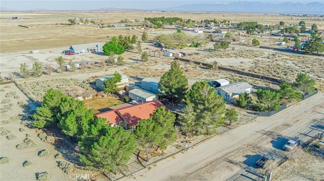 bird's eye view with view of desert, a rural view, and a mountain view