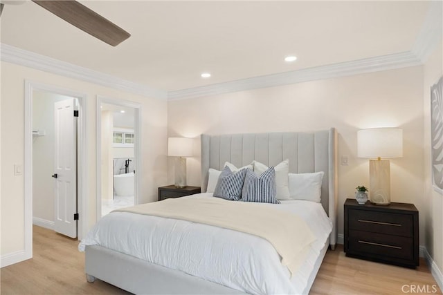 bedroom featuring crown molding, light wood-style flooring, baseboards, recessed lighting, and ensuite bath