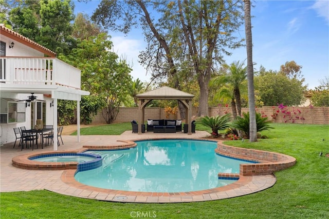 view of pool featuring a fenced backyard, an outdoor hangout area, a lawn, a gazebo, and a pool with connected hot tub