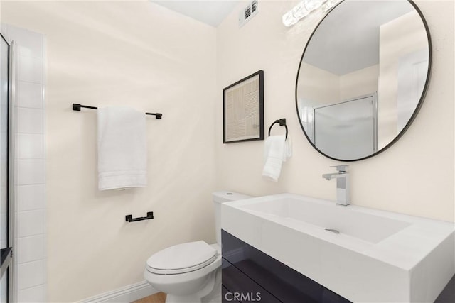 full bathroom featuring a shower, toilet, vanity, and visible vents