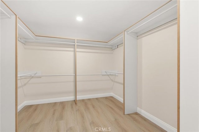 spacious closet with wood finished floors