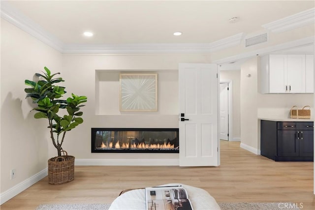 interior space with wood finished floors, visible vents, and baseboards
