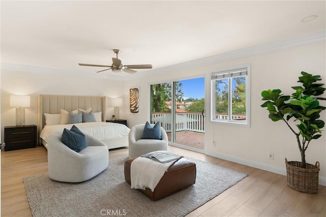 bedroom featuring crown molding, baseboards, access to outside, and light wood-type flooring