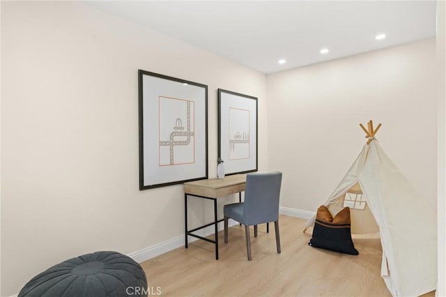 office area featuring recessed lighting, baseboards, and light wood-style floors