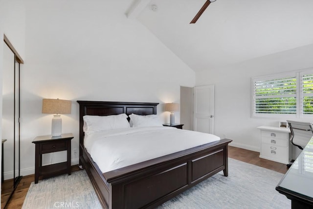 22724 Califa St, Woodland Hills, CA 91367 - bedroom featuring beamed ceiling, high vaulted ceiling, baseboards, light wood finished floors, and a ceiling fan